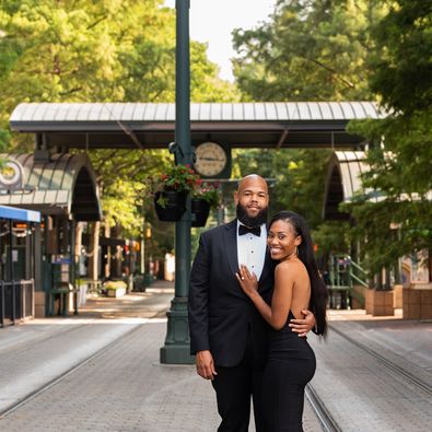 couple hugging and smiling on street